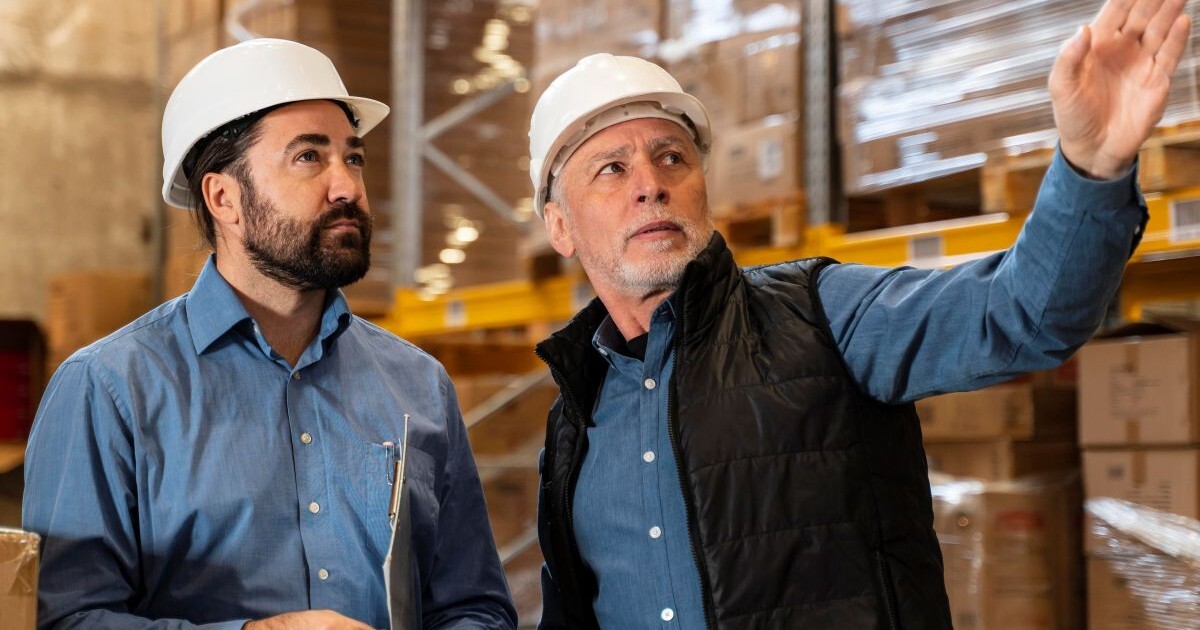 Business owner and advisor reviewing operations before a business sale and valuation