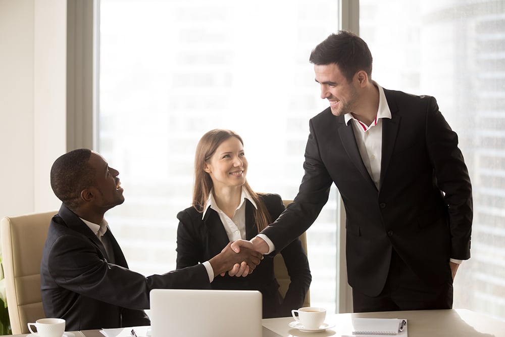 appraiser and clients agreeing to collaborate on appraisal project
