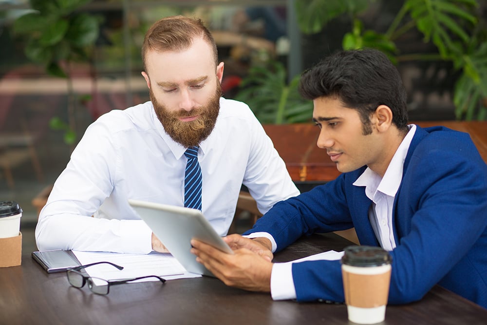 Business appraiser consultiing with client post report