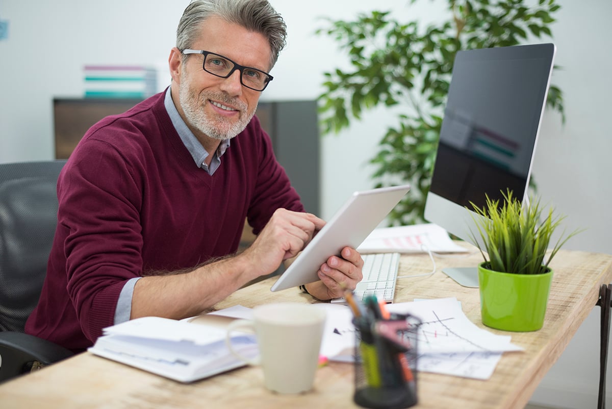 Business owner selling company happy with business valuation report